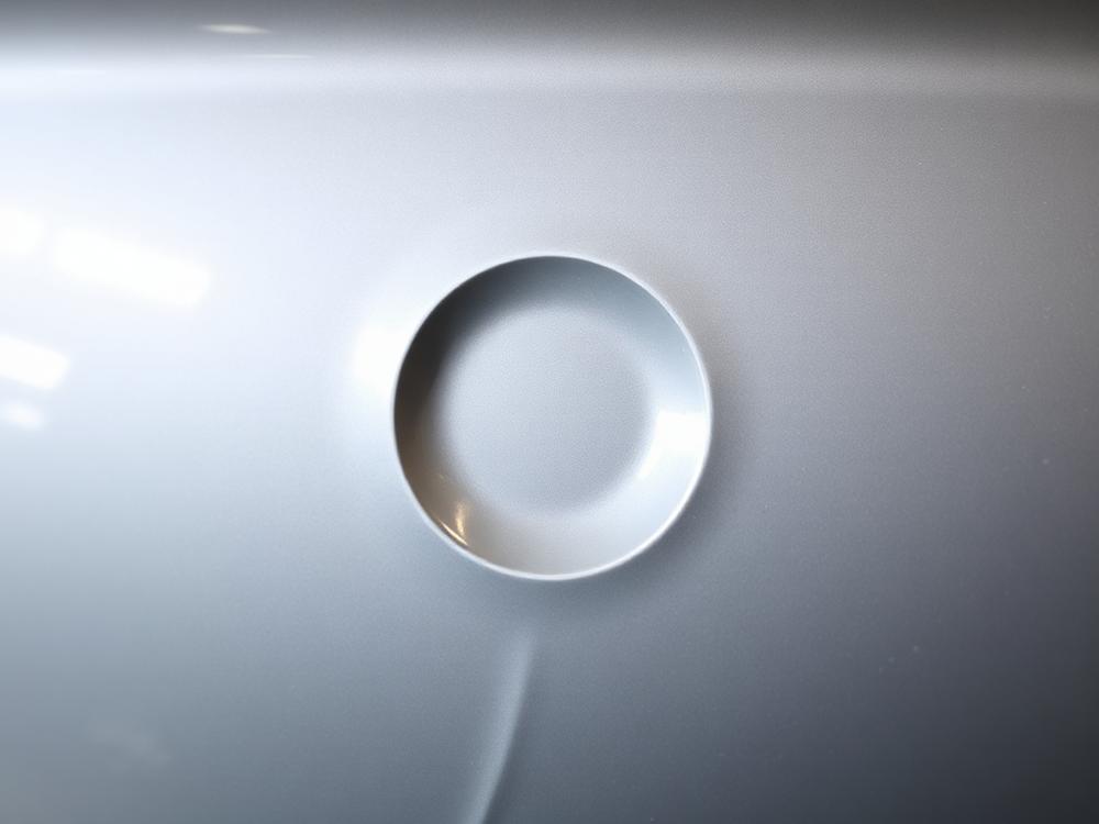 Door panel dent — Before paintless dent repair