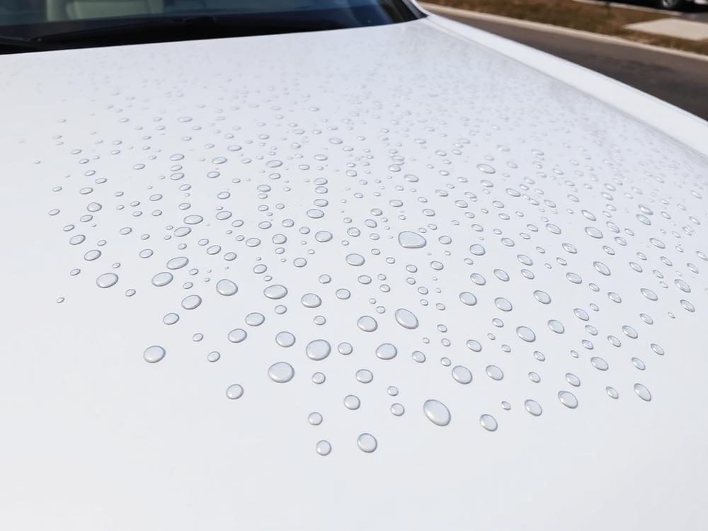 Hail damage on hood — Before paintless dent repair